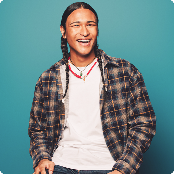 Man with plaid shirt smiling